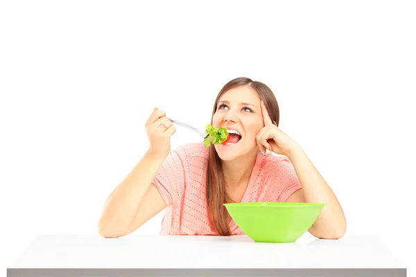 Smiling female eating salad — Stock Photo, Image