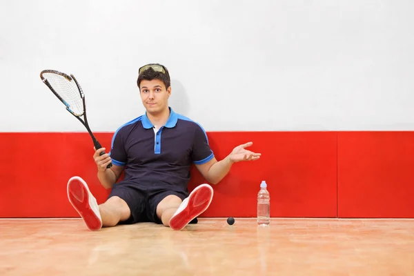 Squash player holding racket — Stock Photo, Image