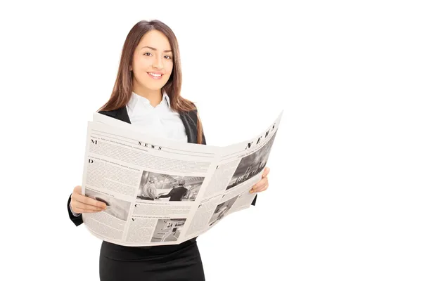 Young businesswoman holding newspaper — Stock Photo, Image