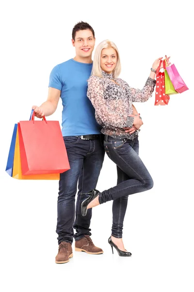 Couple holding shopping bags Royalty Free Stock Images
