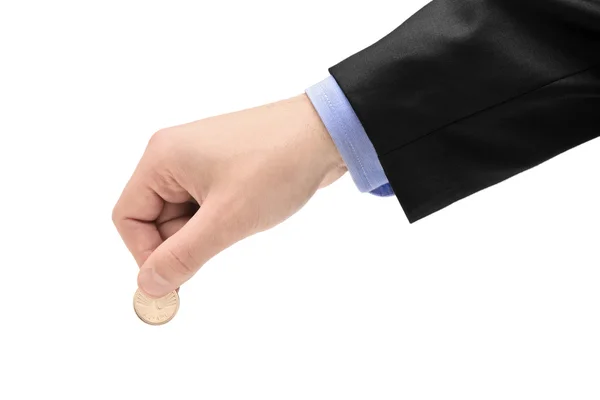 Person holding coin Stock Photo