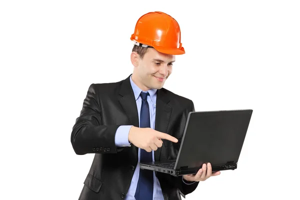 Architect pointing at laptop Stock Image