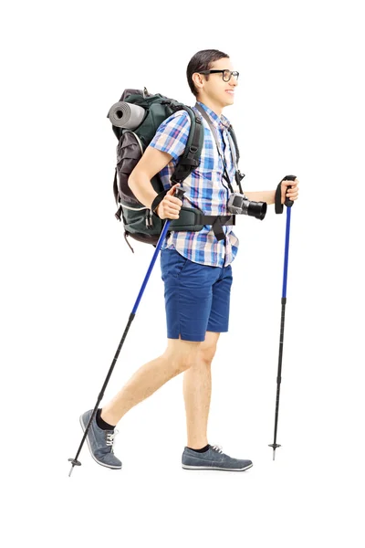 Tourist walking with hiking poles — Stock Photo, Image