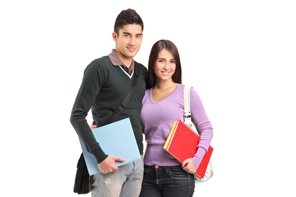 Smiling couple holding books Stock Photo