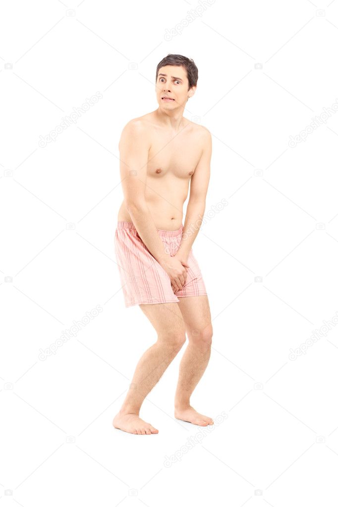 Embarrassed naked man in underwear