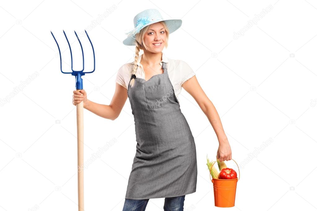 Farmer holding bucket with vegetables