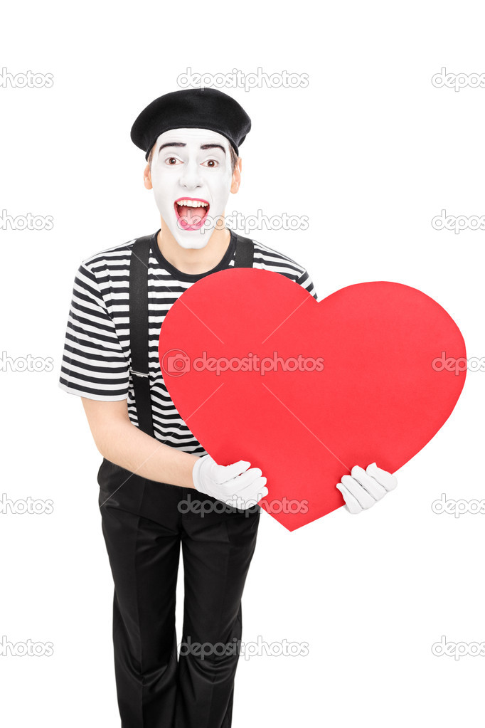 Mime artist holding red heart