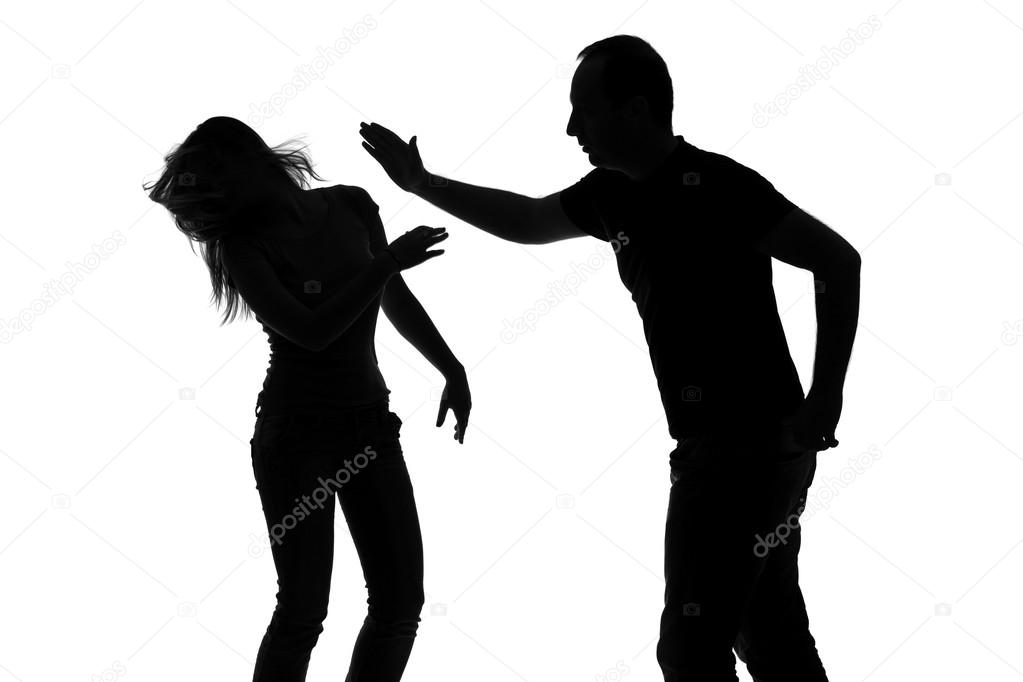 Silhouette of man slapping woman