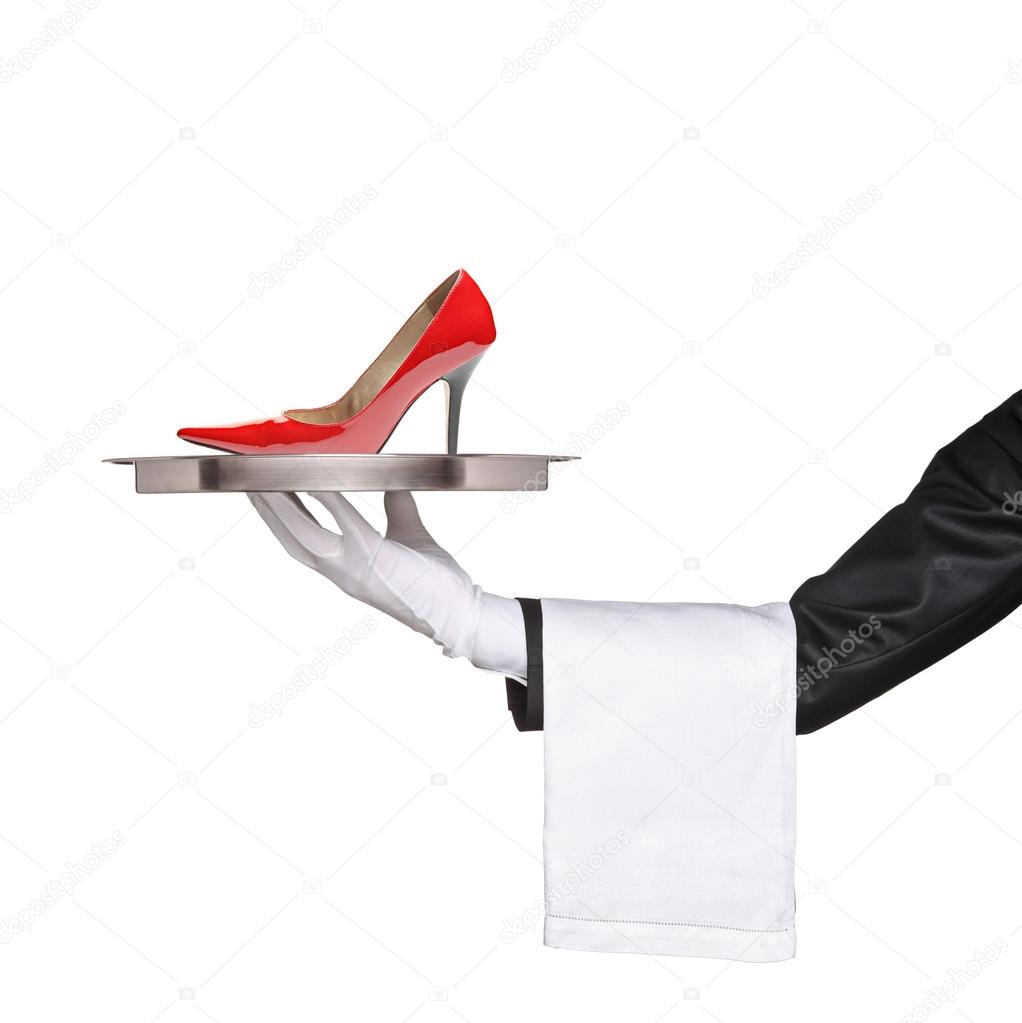 Waiter holding red high heel