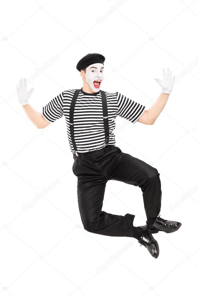 Mime artist jumping with joy