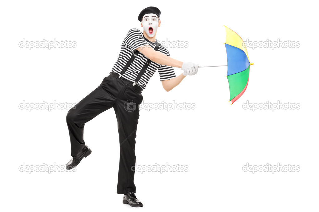 Mime artist holding an umbrella