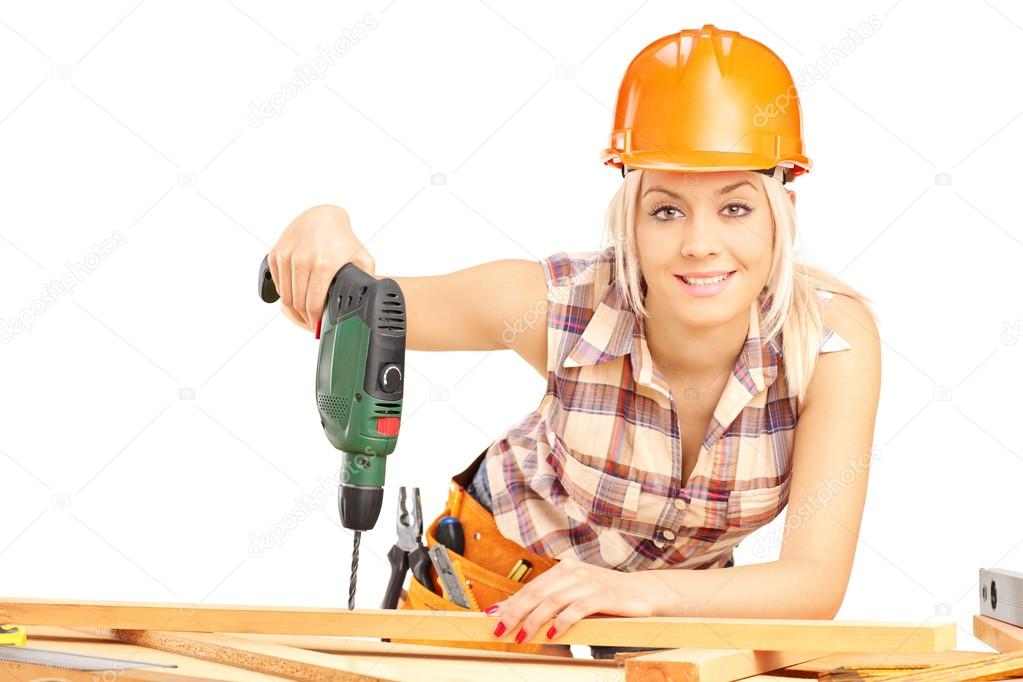Carpenter using hand drilling machine
