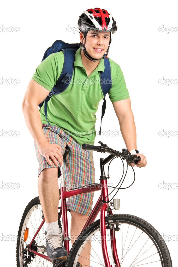 Bicyclist posing on bicycle
