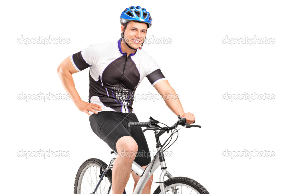 Male biker posing on bike