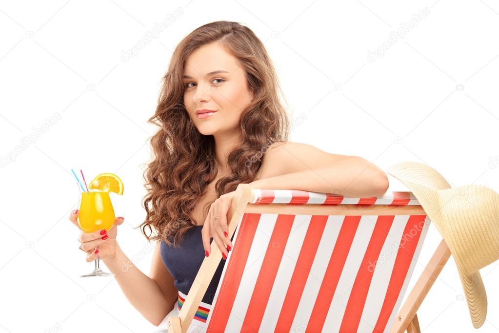 Female sitting on sun lounger