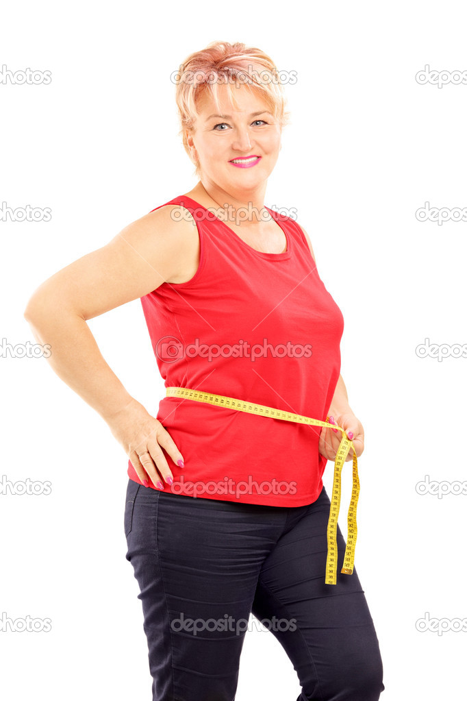 Mature woman measuring her waist