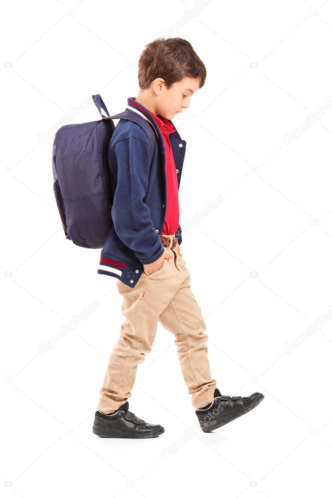 Sad school boy walking