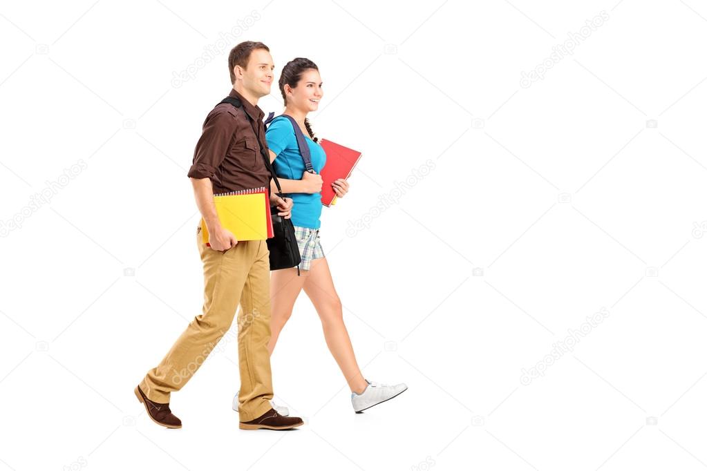Two students holding books
