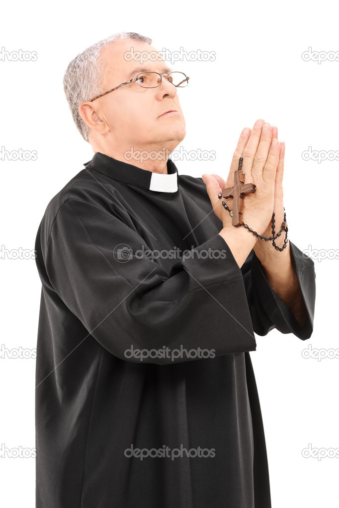 Mature priest praying to god