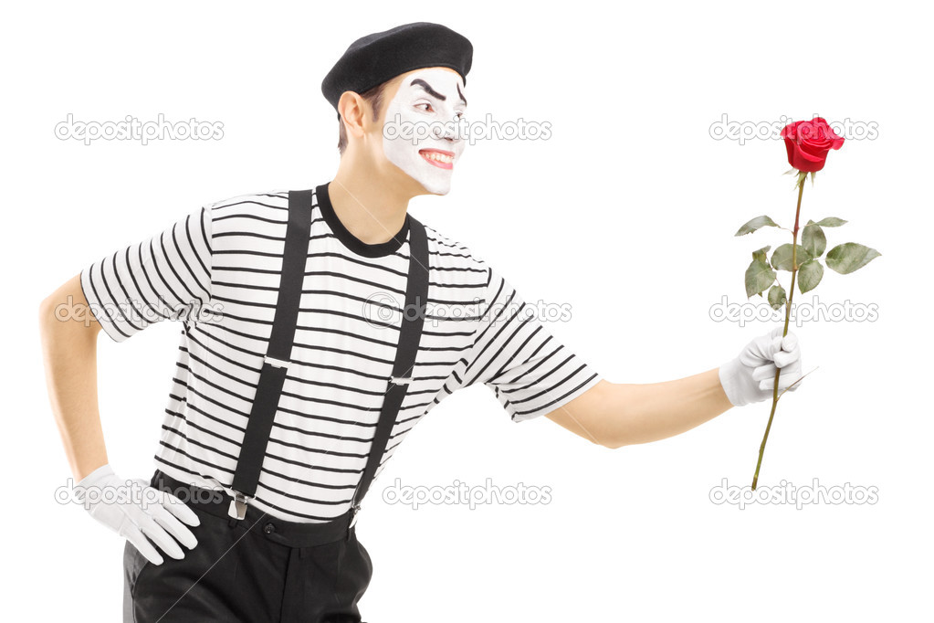 Mime artist giving flower