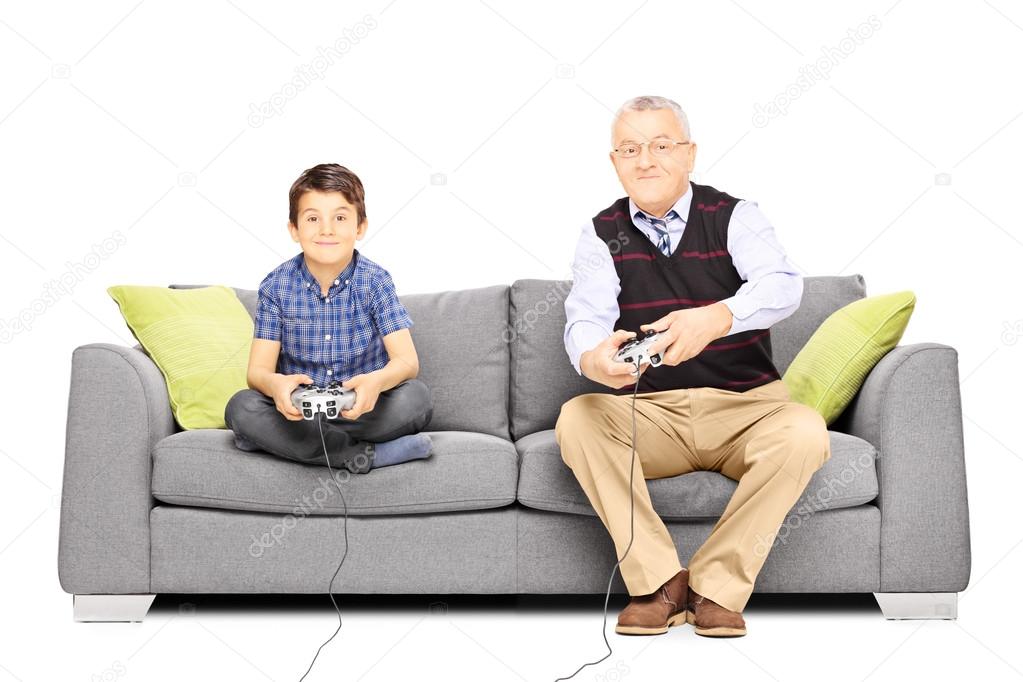 Grandfather with nephew playing video games