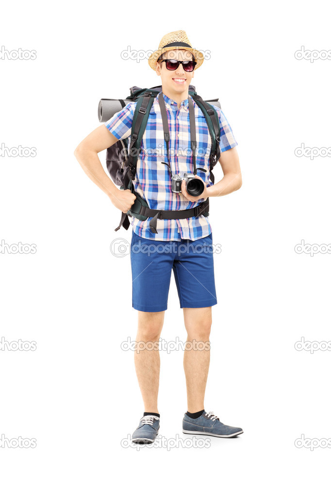 Male hiker with backpack and camera