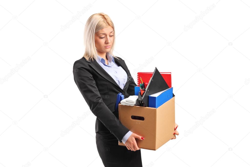 Fired businesswoman carrying box
