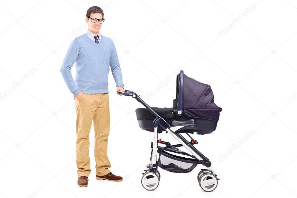 Father holding baby stroller