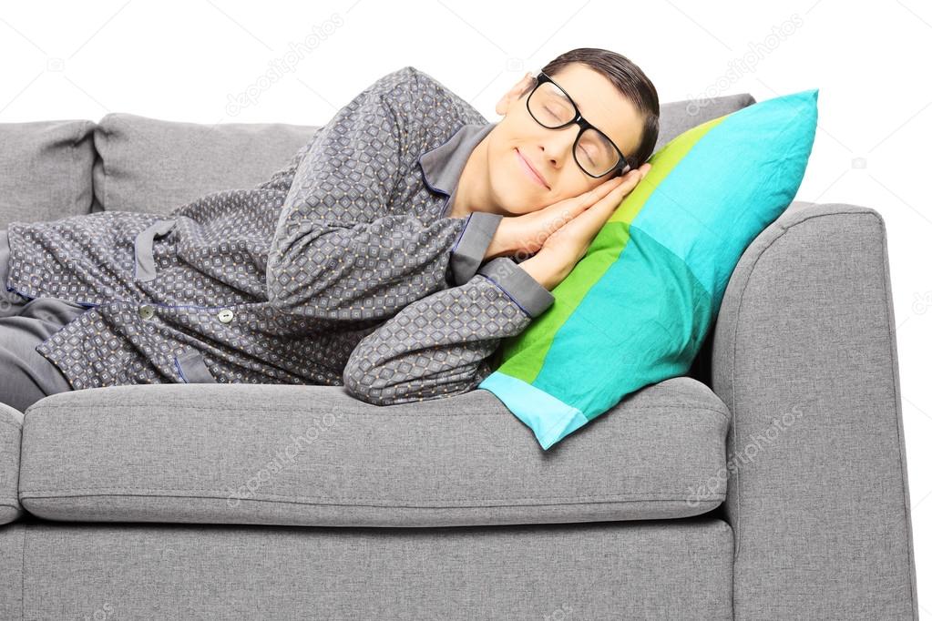 Man calmly sleeping on a couch