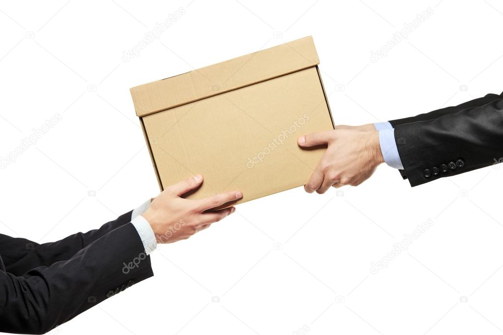 Businessman delivering package to man