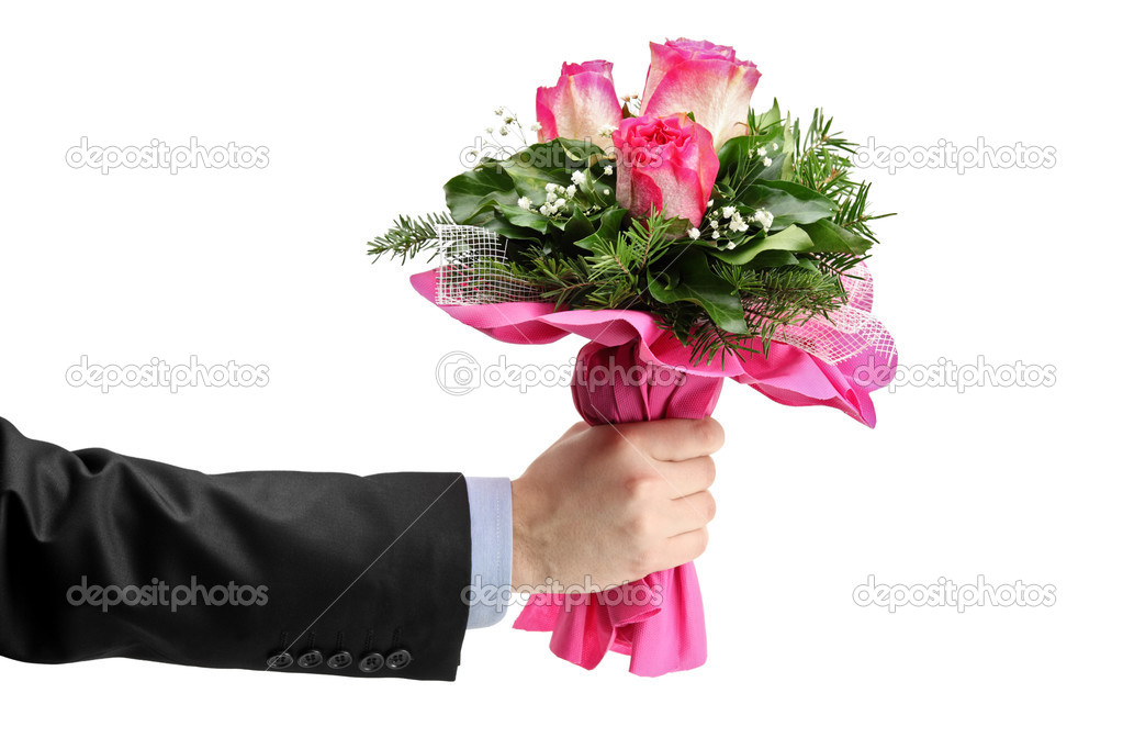 Hand holding bunch of roses
