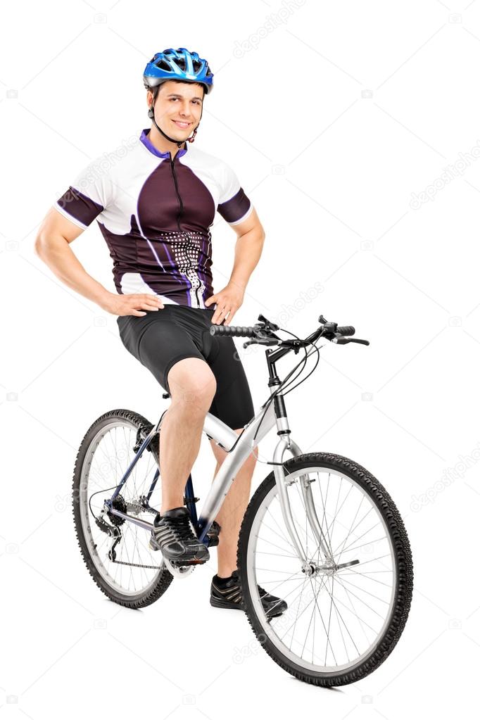 Smiling bicyclist posing on bicycle