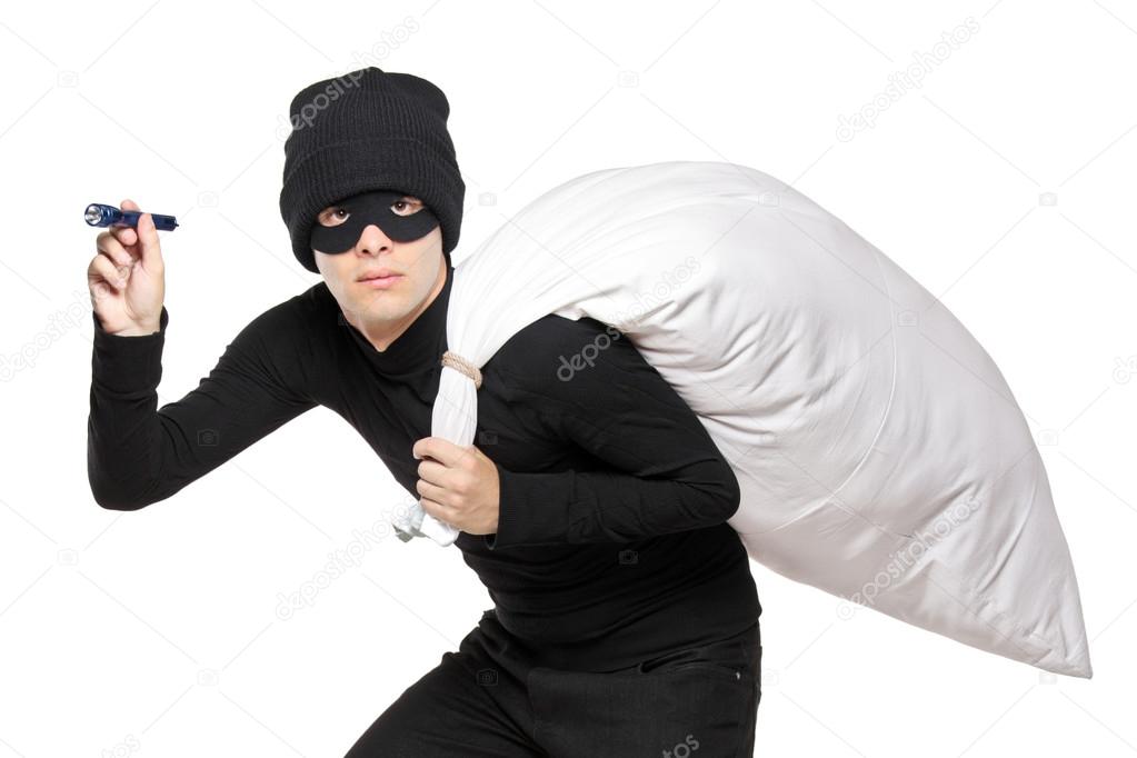 Robber with bag and flashlight