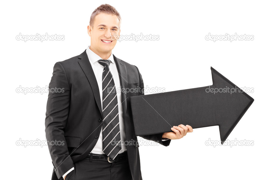 Businessman holding a black arrow