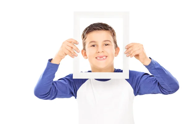 Young boy holding a picture frame — Stock Photo, Image