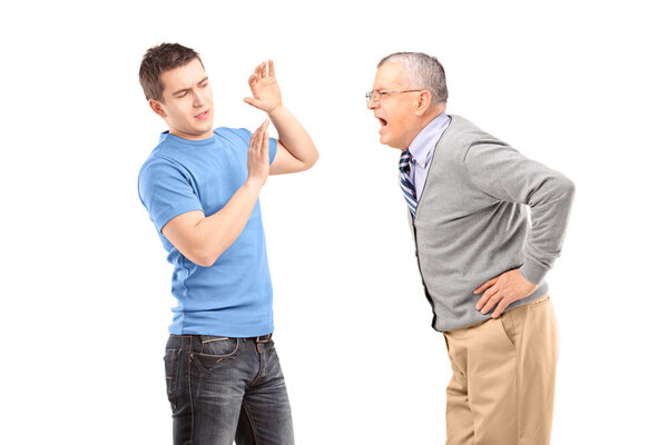 Mature man yelling at young man
