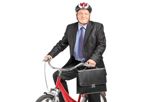 Bisiklet üzerinde olgun iş adamı — Stok fotoğraf