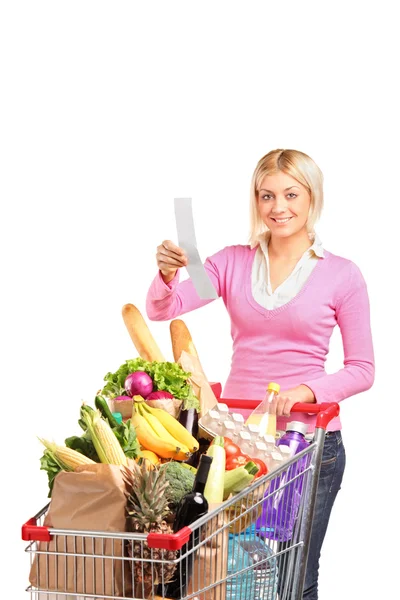 Woman checking her shopping receipt — Stock Photo, Image