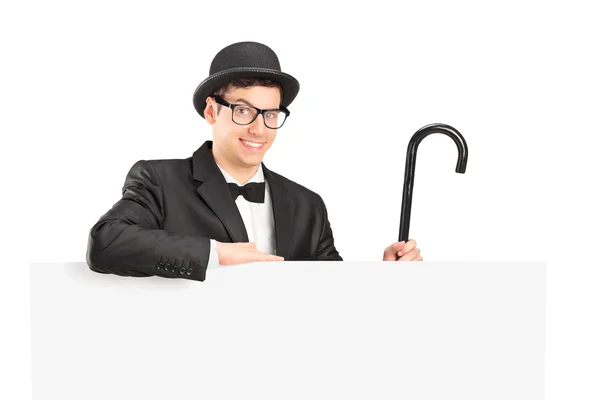 Performer in suit behing panel — Stock Photo, Image