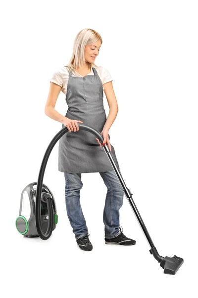 Limpeza feminina com aspirador — Fotografia de Stock