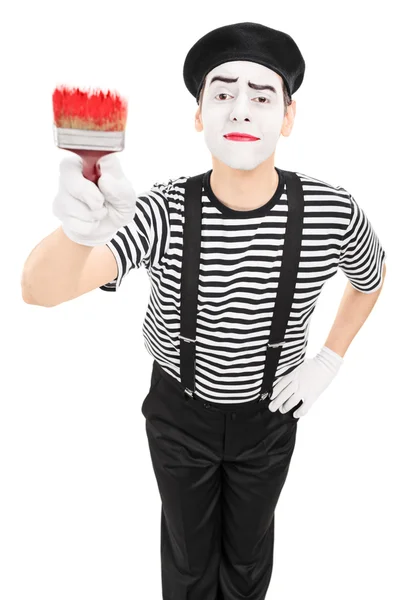 Mime artist holding a paintbrush — Stock Photo, Image