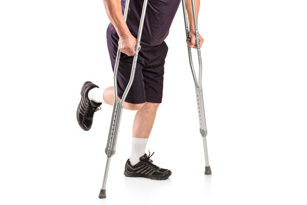 An injured man on crutches