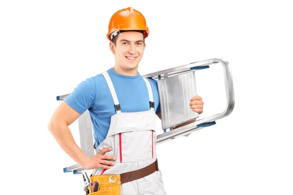 Worker with helmet carrying ladder — Stock Photo, Image