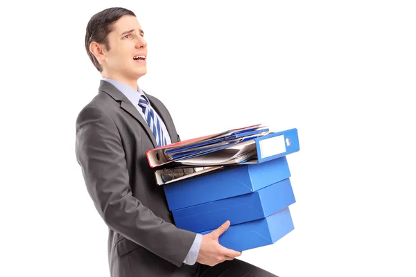 Professional man carrying heavy folders — Stock Photo, Image