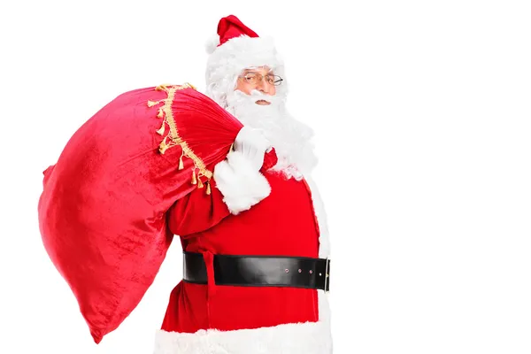 Babbo Natale che cammina con borsa — Foto Stock