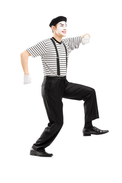 Mime artist simulate walking on rop