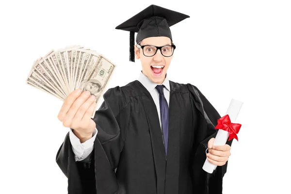 College graduate holding a diploma and money — Stock Photo, Image