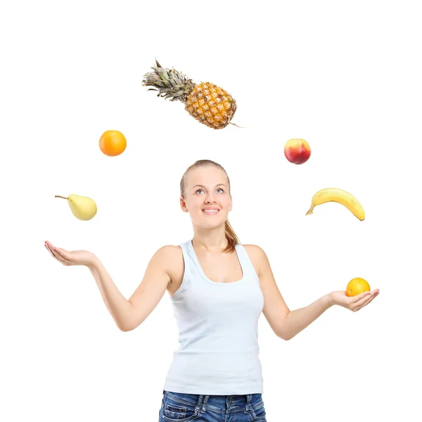 Mujer malabarismo frutas —  Fotos de Stock