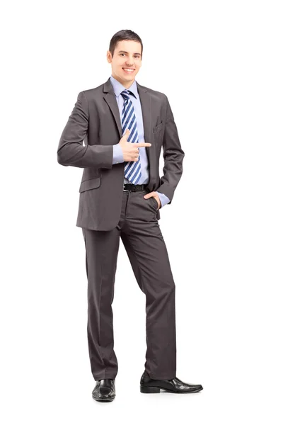 Businessman standing and pointing — Stock Photo, Image