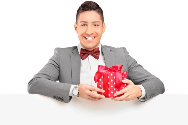 Guy holding gift — Stock Photo, Image